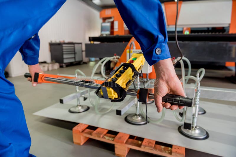 Worker Uses Suction Cups for Transporting Large Sheets of Metal Stock Photo Image of