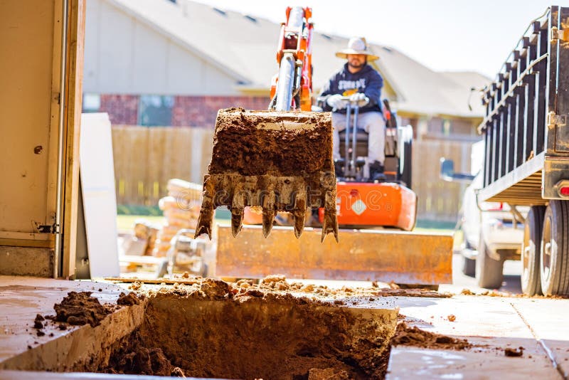 Worker Was Working on a Garage Underground Storm Shelter Installation