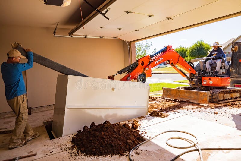 Worker Was Working on a Garage Underground Storm Shelter Installation
