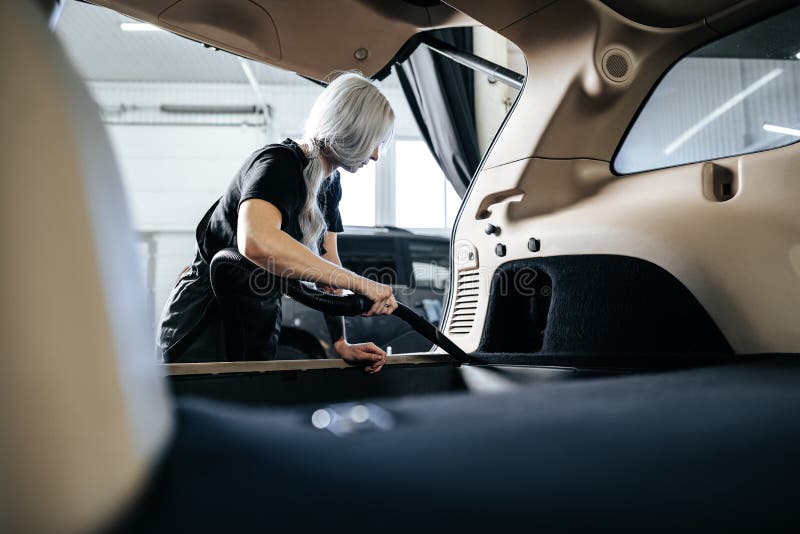 Worker Woman Vacuum Cleaning Dust Interior Inside Car In Car Wash