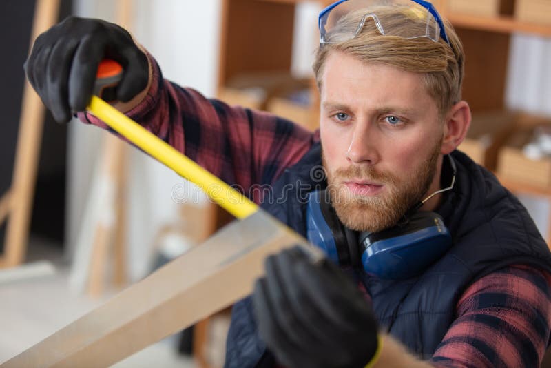 Worker in Measuring Metal Stock Photo Image of