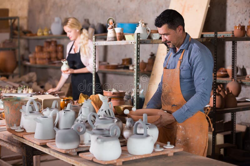 Workers in Ceramics Workroom with Pottery Wheel Stock Photo Image of