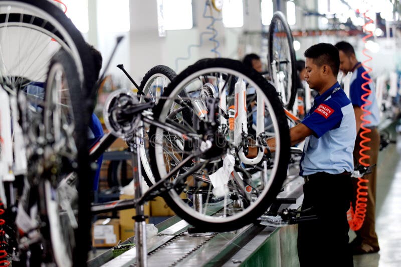 Workers Check on the Assembly Line at the Assembly Bicycle Bike