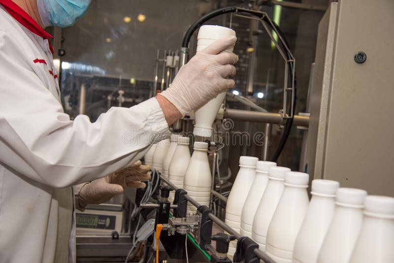 Workers Check a Bottle of Milk on a Modern Dairy Plant Stock Photo Image of automation