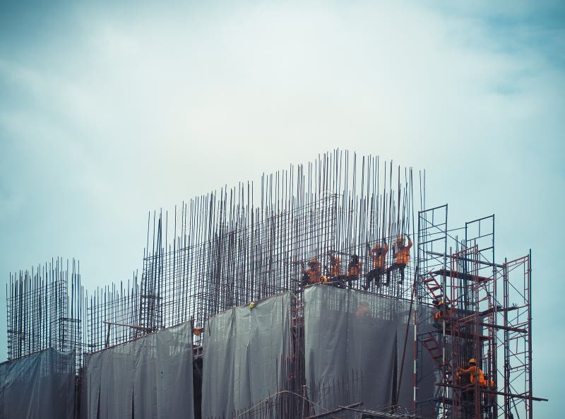 Workers in construction site are tied up with steel structures. royalty free stock photos Workers in construction site are tied up with steel structures. royalty free stock photos