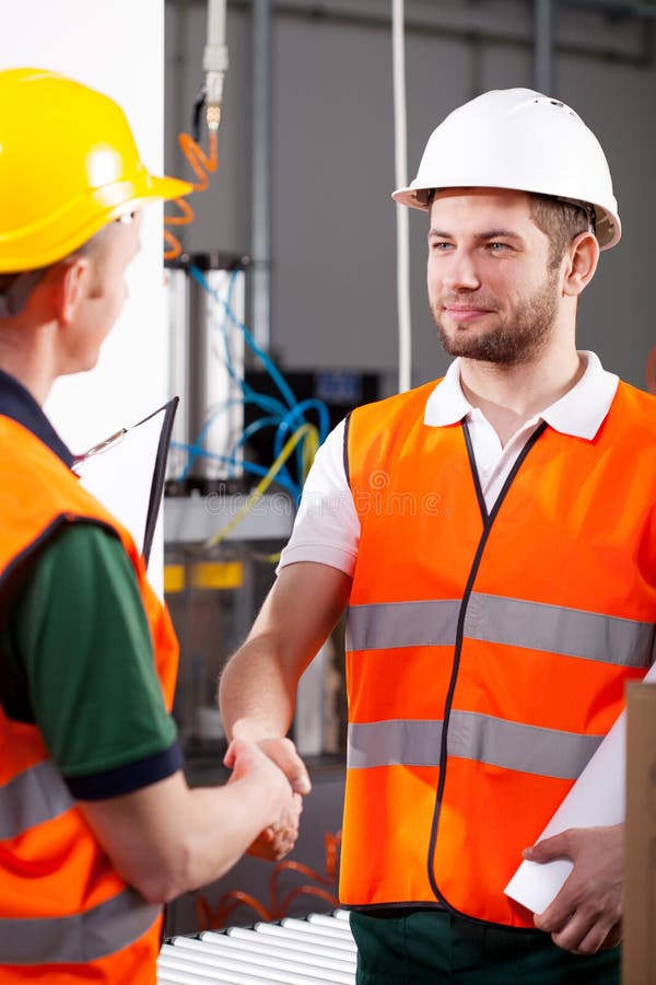 Workers in factory stock images