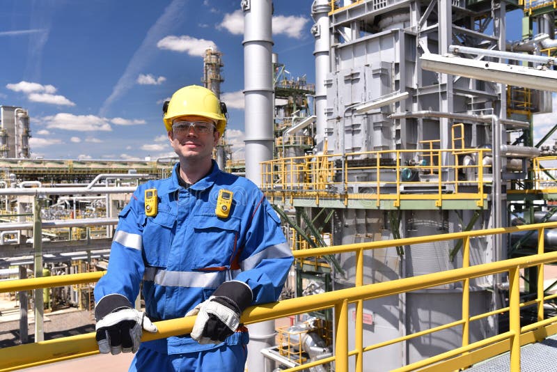 Chemical Industry Plant Workers in Work Clothes in a Refinery with