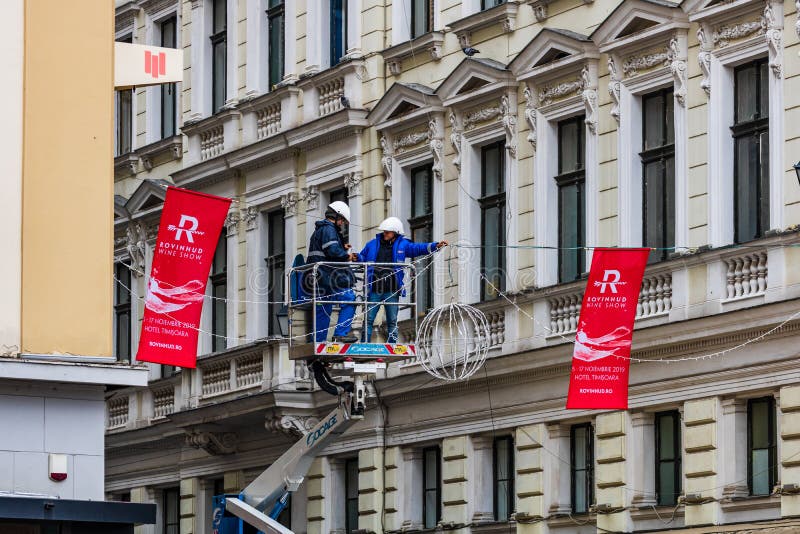 Workers installing Christmas lights over main shopping street in Timisoara, Romania, 2019