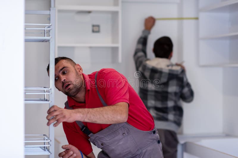 Workers Installing a New Kitchen Stock Photo Image of profession