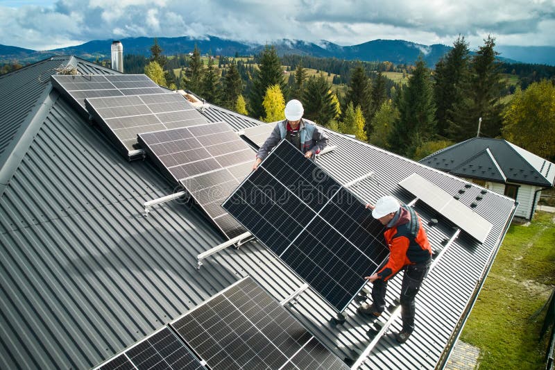 workers-lifting-up-photovoltaic-solar-module-while-installing-solar