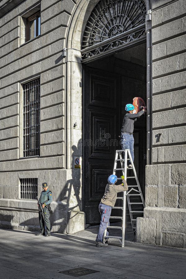Workers with ladder