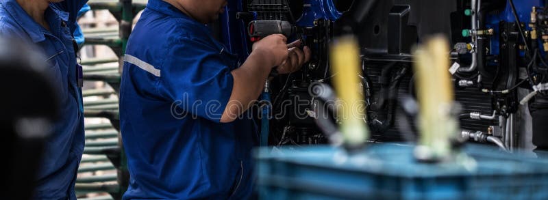 Workers in machinery factory in China. royalty free stock photography