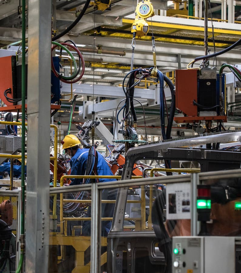 Workers in machinery factory in China. royalty free stock photos