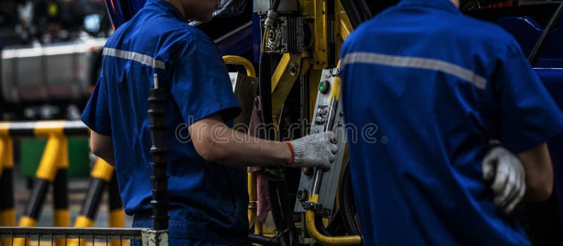 Workers in machinery factory in China. royalty free stock photography