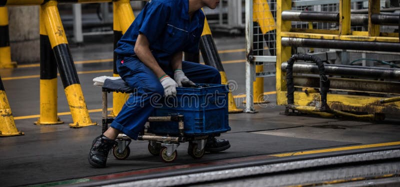 Workers in machinery factory in China. royalty free stock image