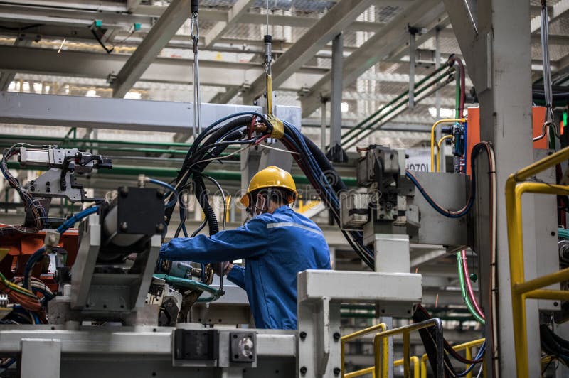 Workers in machinery factory in China. stock images