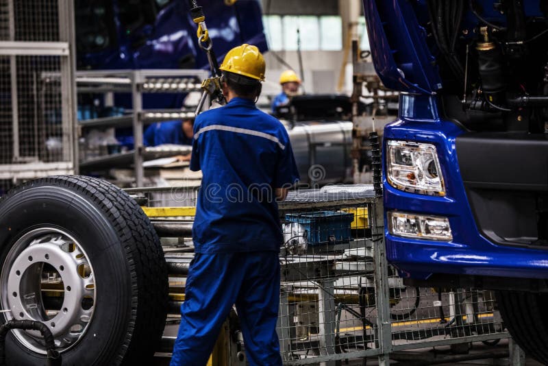 Workers in machinery factory in China. stock images
