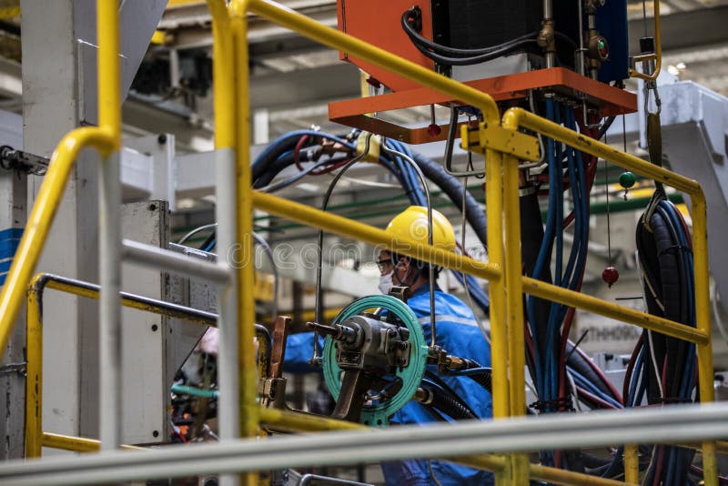 Workers in machinery factory in China. stock images