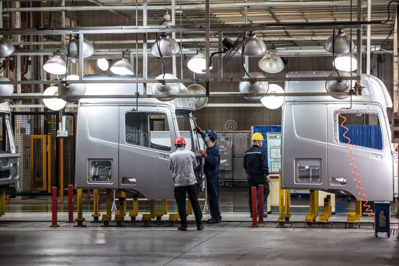 Workers in machinery factory in China. royalty free stock photos