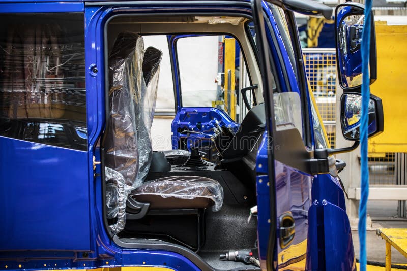 Workers in machinery factory in China. stock image