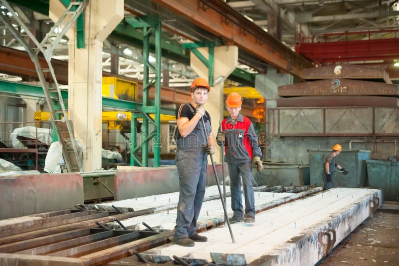 Workers on plant of ferroconcrete products royalty free stock photos Workers on plant of ferroconcrete products royalty free stock photos