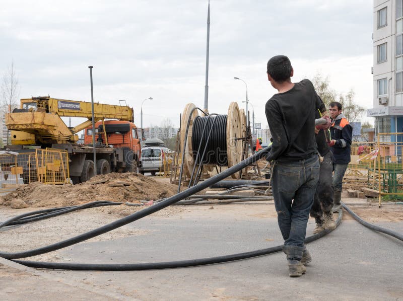 Workers Pull the Electrical Cable Editorial Stock Image Image of