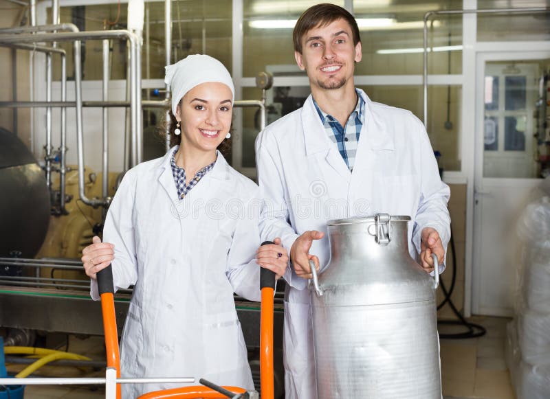 Workers Showing Dairy Production Process Stock Photo Image of adult