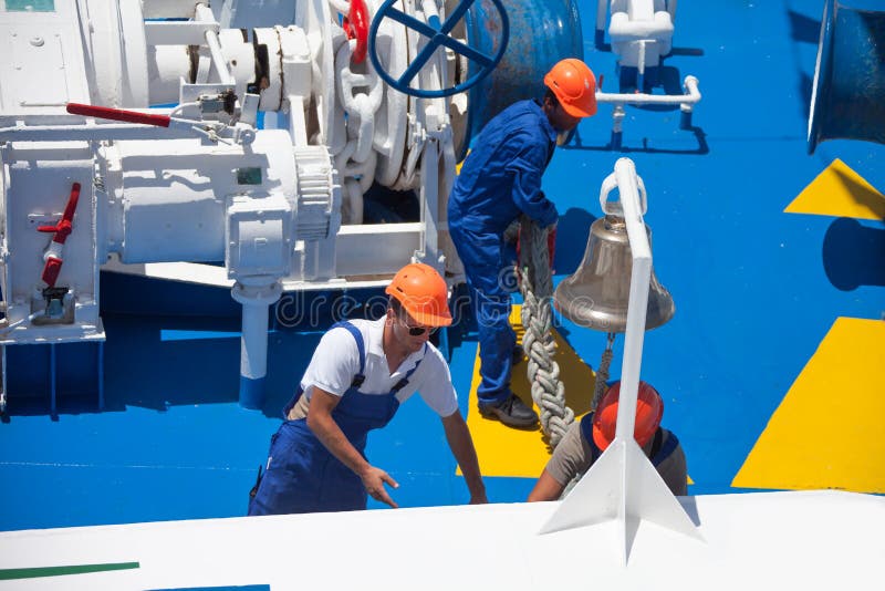 Workers at the stern of the liner