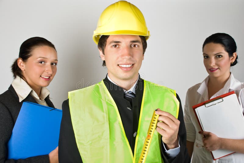 Portrait of group of people workers ,architect man in front of image showing a measurement tool,check out. Architect uniform stock images, royalty-free photos and pictures