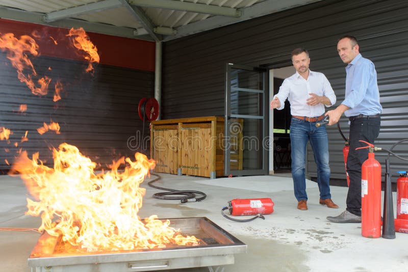 2 workers training in case fire emergency royalty free stock photography