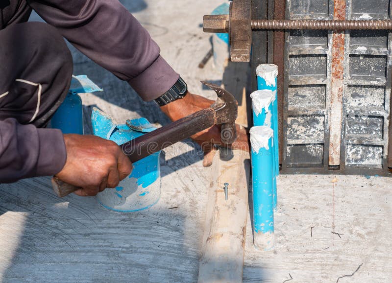 Hammer Concrete with a Hammer Drill To Make a Hole for Heating Pipes. Tools  of Plumber for Clamps the Connectors on the Stock Photo - Image of  installing, repair: 235550748