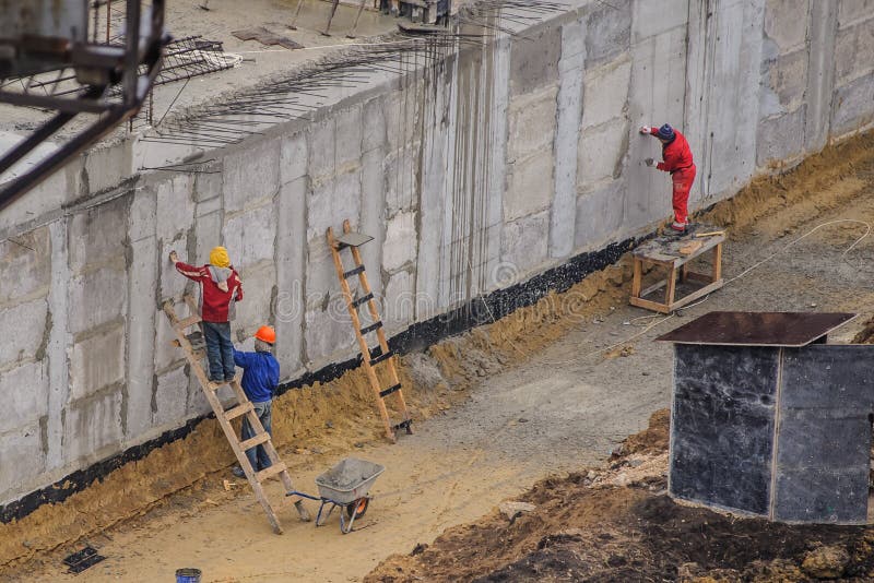 workers working at a construction site stock image workers working at a construction site stock image