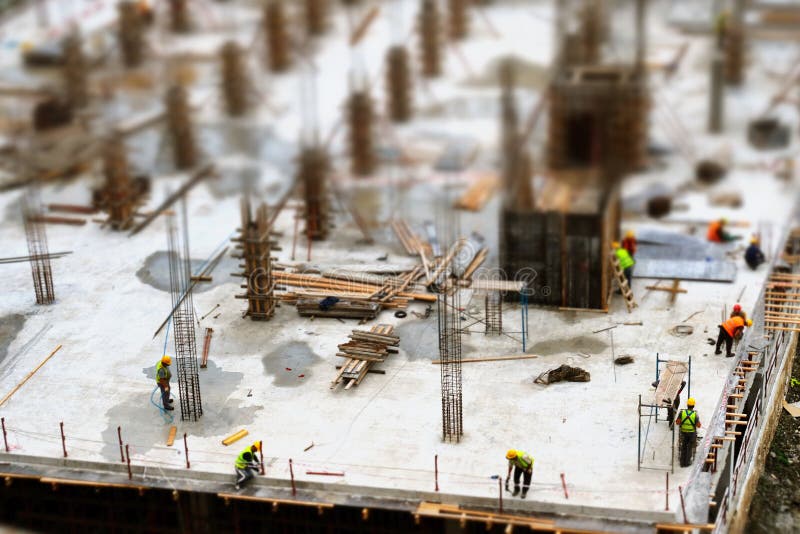 Miniature Construction Workers Building Plans Stock Photo 367707245