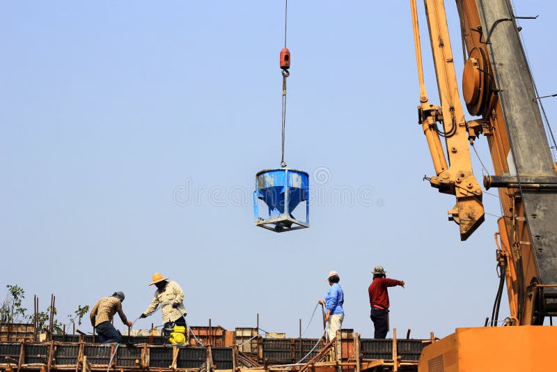 Workers working with crane stock image