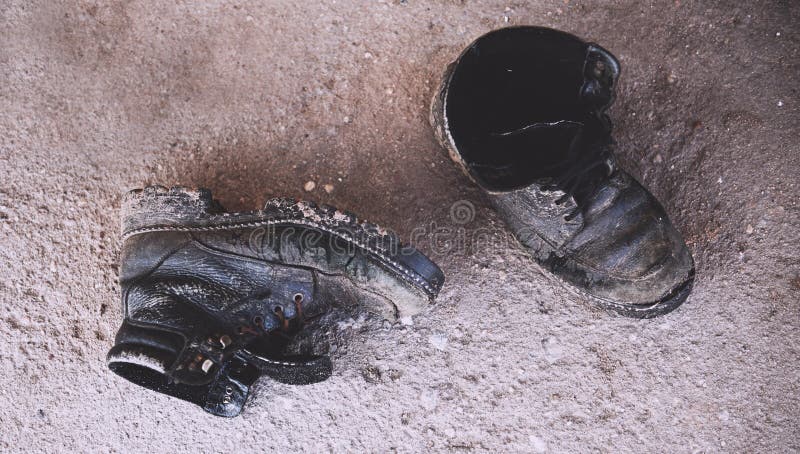 Workers` Worn Out, Dirty Boots on the Concrete Floor Stock Photo ...