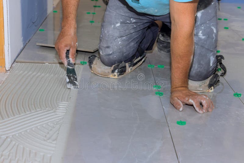 Working with Ceramic Floor Tiles on an Adhesive Surface for Home