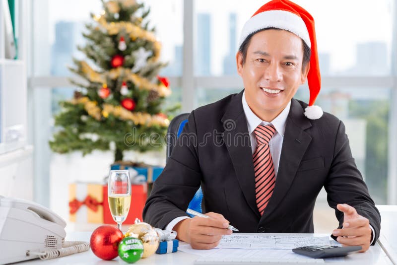 Working on Christmas eve stock photo. Image of handsome 106011944