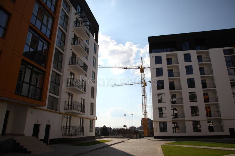 Working crane on the construction of the house.