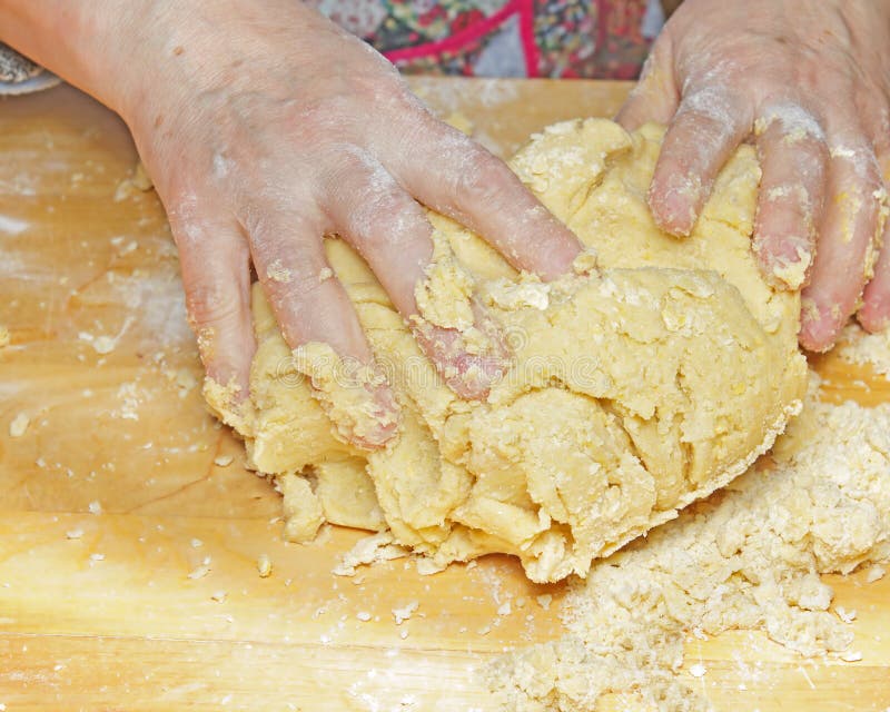 Hands working dough on kneading board. Dought stock images, royalty-free photos and pictures