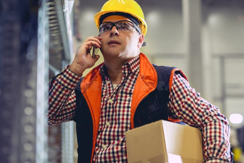 Working Hard. Warehouse Workers. Stock Photo Image of indoors, male