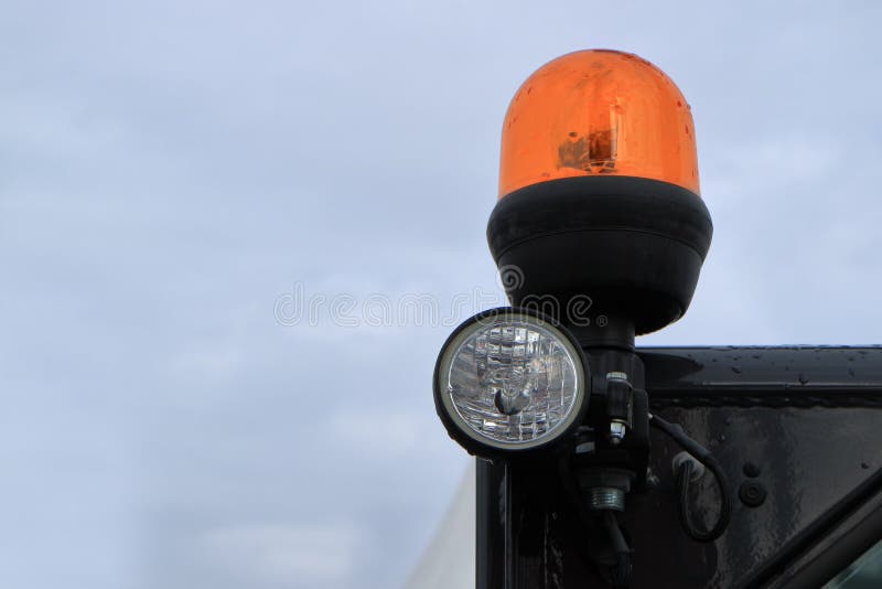 The working light of a modern tractor. Lighting equipment of a modern tractor royalty free stock photo