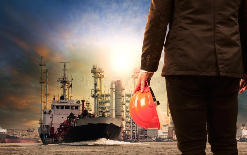 Working man and oil refinery with lpg gas storage ship transport