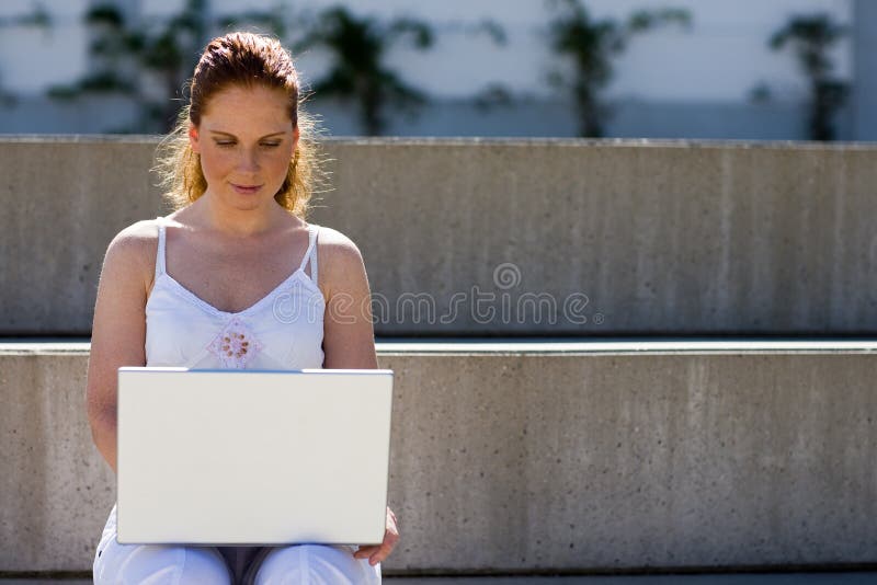 Working outdoor with laptop