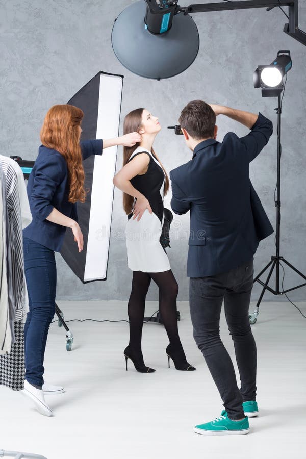 Working on the portfolio of a young model royalty free stock photography Working on the portfolio of a young model royalty free stock photography