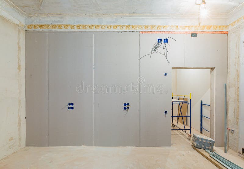 Working process of installing gypsum walls from plasterboard -drywall - in apartment is under construction, remodeling royalty free stock image