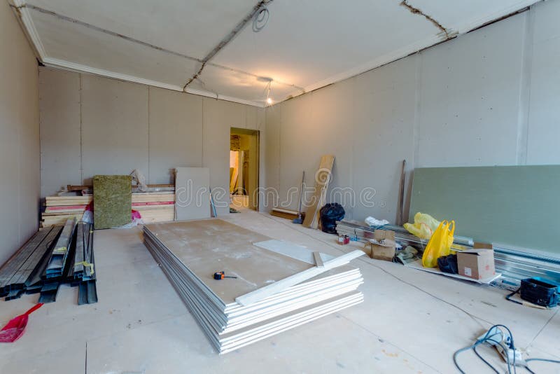 Working process of installing metal frames for plasterboard drywall for gypsum walls in apartment is under construction stock images Working process of installing metal frames for plasterboard drywall for gypsum walls in apartment is under construction stock images