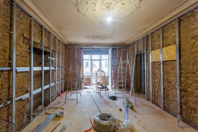 Working process of installing metal frames for plasterboard drywall for making gypsum walls stock photo