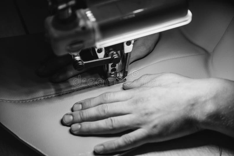 Tanner Sews Leather on a Special Sewing Machine, Close Up. Leather