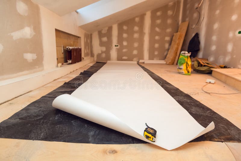 Working process of wallpapering on the drywall in small room apartment is under construction, remodeling, renovation royalty free stock image
