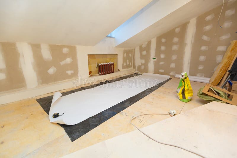 Working process of wallpapering on the drywall in small room apartment is under construction, remodeling, renovation stock photo